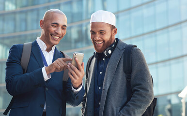 Business, smartphone and men in city, conversation and online reading to share ideas. Corporate, Islamic male and friends in town, cellphone and discussion for social media, typing and connection