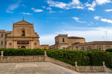 Fototapeta na wymiar Scenic view in Noto, with San Salvatore Church and Santa Chiara Church. Province of Siracusa, Sicily, Italy.