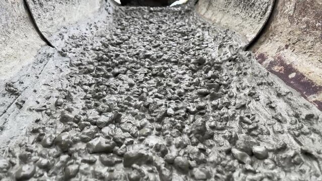 Pouring concrete mix on concreting formwork. Slow Motion