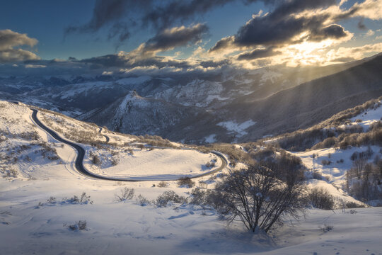 Winter scenery with road and mountains, San Glorio, Liebana, Cantabria, Spain