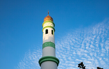 islamic mosque tower on blue sky