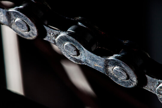 A macro shot of a mountain bike chain.