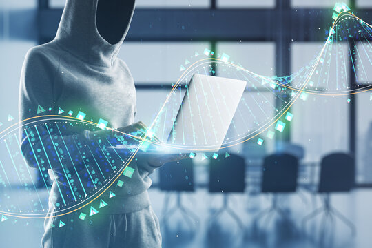 Hacker using laptop with glowing binary code DNA helix on blurry office interior background. Human genome, hacking, phishing and innovative technologies concept. Double exposure.