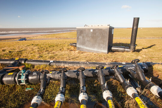 Methane, extracted from an old landfill site on Walney Island, to power a biogas generator producing green electricity, Cumbria, UK
