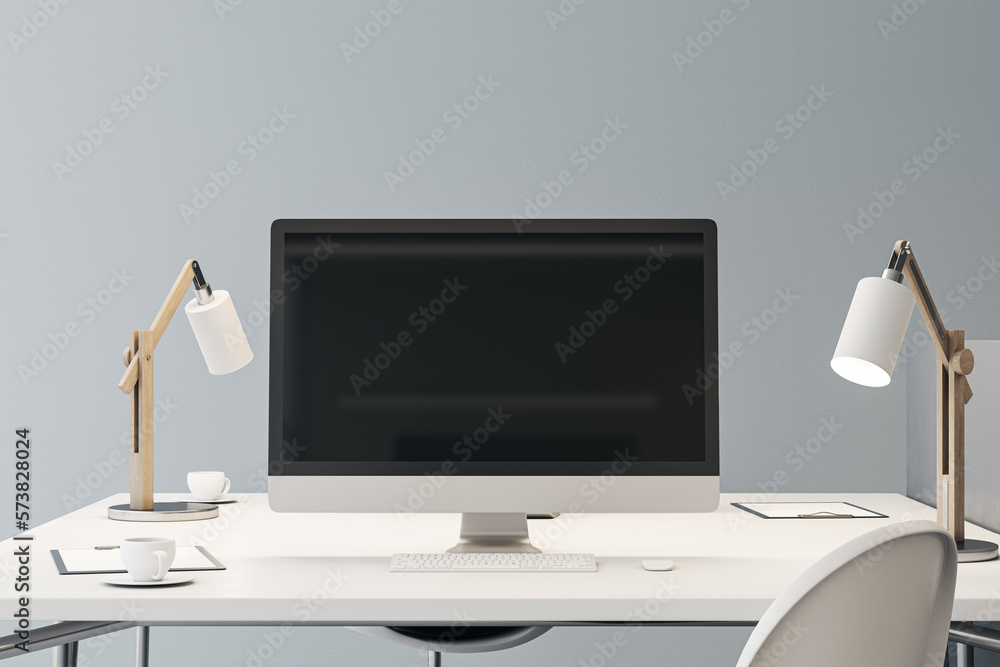 Aufkleber Front view on blank black modern computer screen with place for your logo or text on white work table with stylish lamps on light grey wall background. 3D rendering, mockup