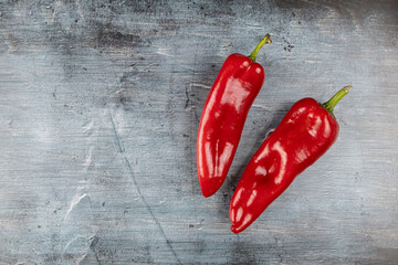 Fresh healthy red paprika above blue moody background