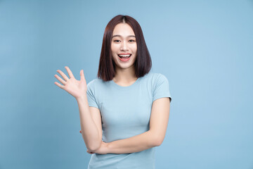 Image of young Asian woman posing on background
