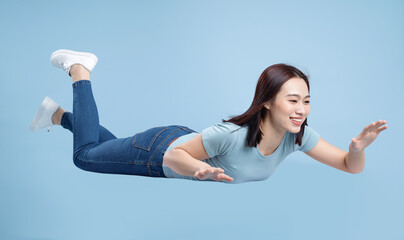 Image of young Asian woman posing on background