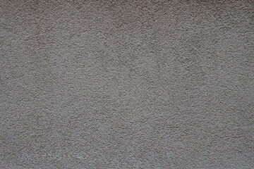 Fototapeta na wymiar Backdrop - dusty wall with coarse light gray roughcast finish