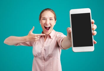 Hand holds big phone with blank screen