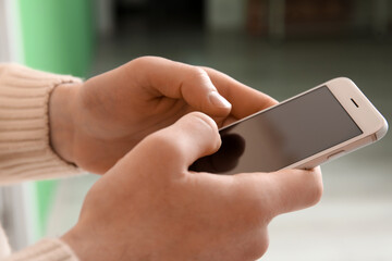 Male hands with modern mobile phone, closeup