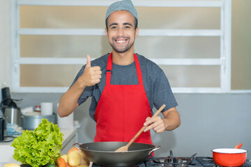 Motivated moroccan chef preparing traditional food