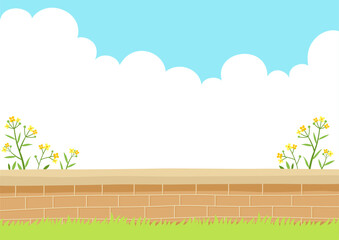 Wildflowers with brick wall. Spring nature background.