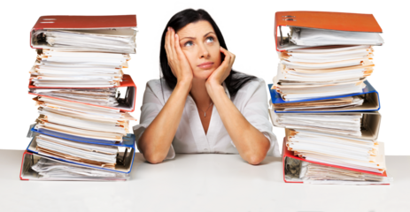 Portrait of an Employee Behind a Stack of Folders Looking Up