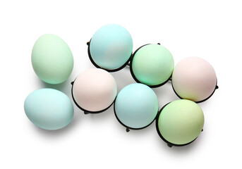 Holder with painted Easter eggs isolated on white background