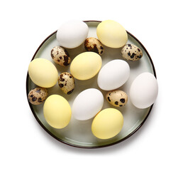 Plate with painted and natural Easter eggs on white background