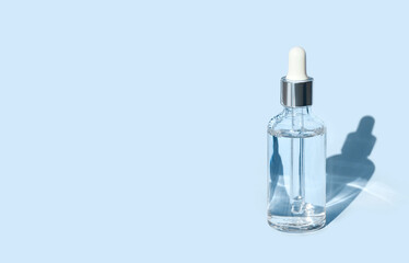 serum on a blue background with natural light