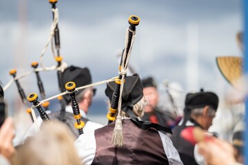 Bands Playing bagpipes in a at an event in Australia. Scottish highland band playing music