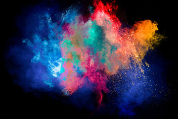 Throw color powder on dark background.Explosion of colored powder isolated on black background.
