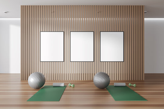 Stylish fitness interior with equipment and three mockup frames