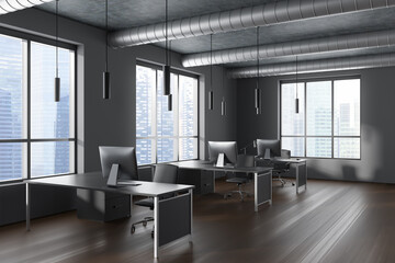 Corner view on dark office room interior with computers, desks
