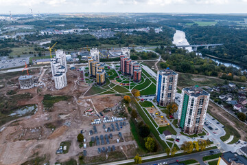 Fototapeta premium aerial panoramic view from great height on red roofs of old big city