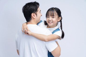 Image of Asian father and daughter on background