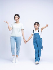Fototapeta premium Image of Asian mother and daughter on background