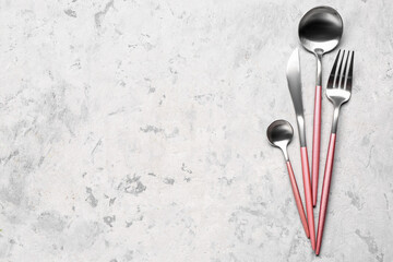 Set of cutlery on grey grunge background