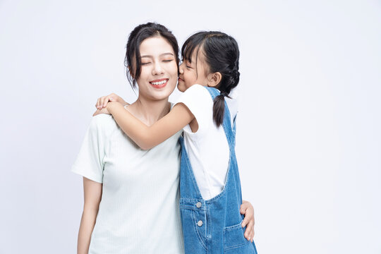 Image of Asian mother and daughter on background