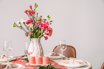 Beautiful table setting for International Women's Day celebration in light room