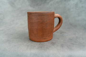 Ceramics, a ceramic product made with their own hands on a potter's wheel, a mug.