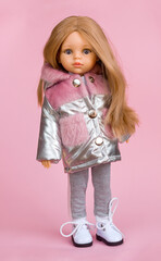 Beautiful vinyl doll in fashionable and stylish clothes, modern dolls for modern children, selective focus