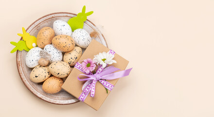 Gift box, Easter eggs and flowers