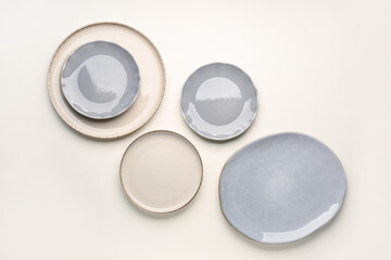 Set of plates on white background