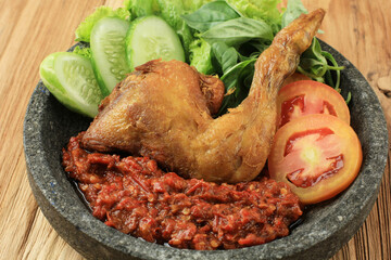 Ayam Penyet or Penyetan Ayam, Fried Chicken with Spicy Sambal Chilli Paste.