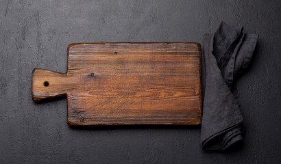 Wooden cutting board and kitchen towel
