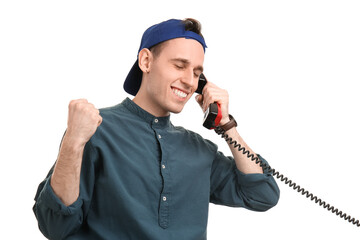 Happy young man talking by phone on white background