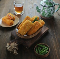 serving of rissole on a wooden tray