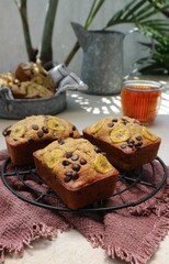 banana and date cakes on an iron tray fresh out of the oven served with tea