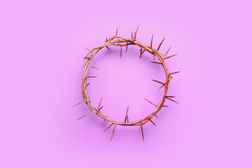 Crown of thorns on lilac background. Good Friday concept