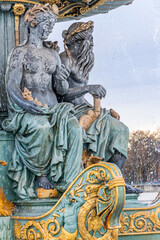 Fototapeta na wymiar Statues of the Fountain of the Seas on the Place de la Concorde square in Paris, France