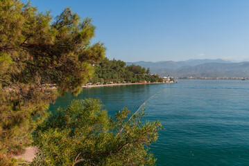 Aegean region. View from opposite bank of peninsula. Club and hotel Letoonia five stars. Emerald water of Aegean Sea. Relaxing atmosphere. Turkey, Fethiye - September 10, 2007