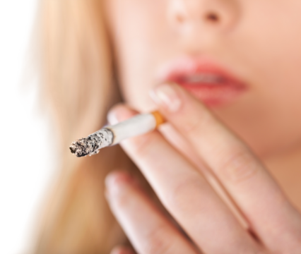 A woman breaking a cigarette, Stop smoking concept