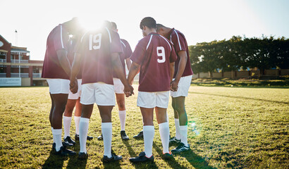 Rugby, field or team in a circle praying for motivation, solidarity or support after sports training. Young men, fitness or group of male athletes in unity before a game or match on a grass stadium - obrazy, fototapety, plakaty