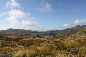 The Old Man of Storr is a famous rock pinnacle on the Isle of Skye, Scotland. A popular hiking spot, it towers at 50 meters high and offers breathtaking panoramic views.