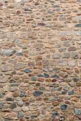 Architecture textures, detailed and rustic of paired masonry granite, traditional spanish and portuguese granite wall, typical iberian orange granite