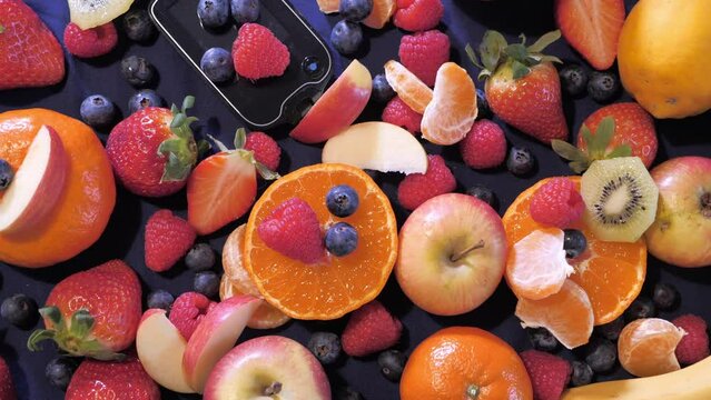 Close-up of fruits on top of a table with a blue background