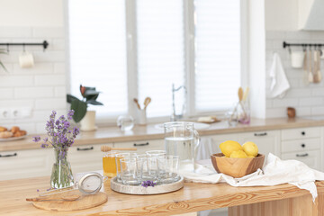 Making a refreshing summer drink. Preparing lemonade in the kitchen. Healthy food concept