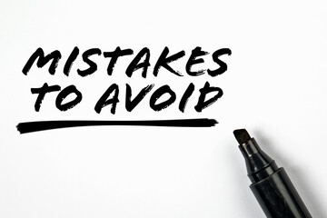 Mistakes To Avoid. Text and black marker on a white background